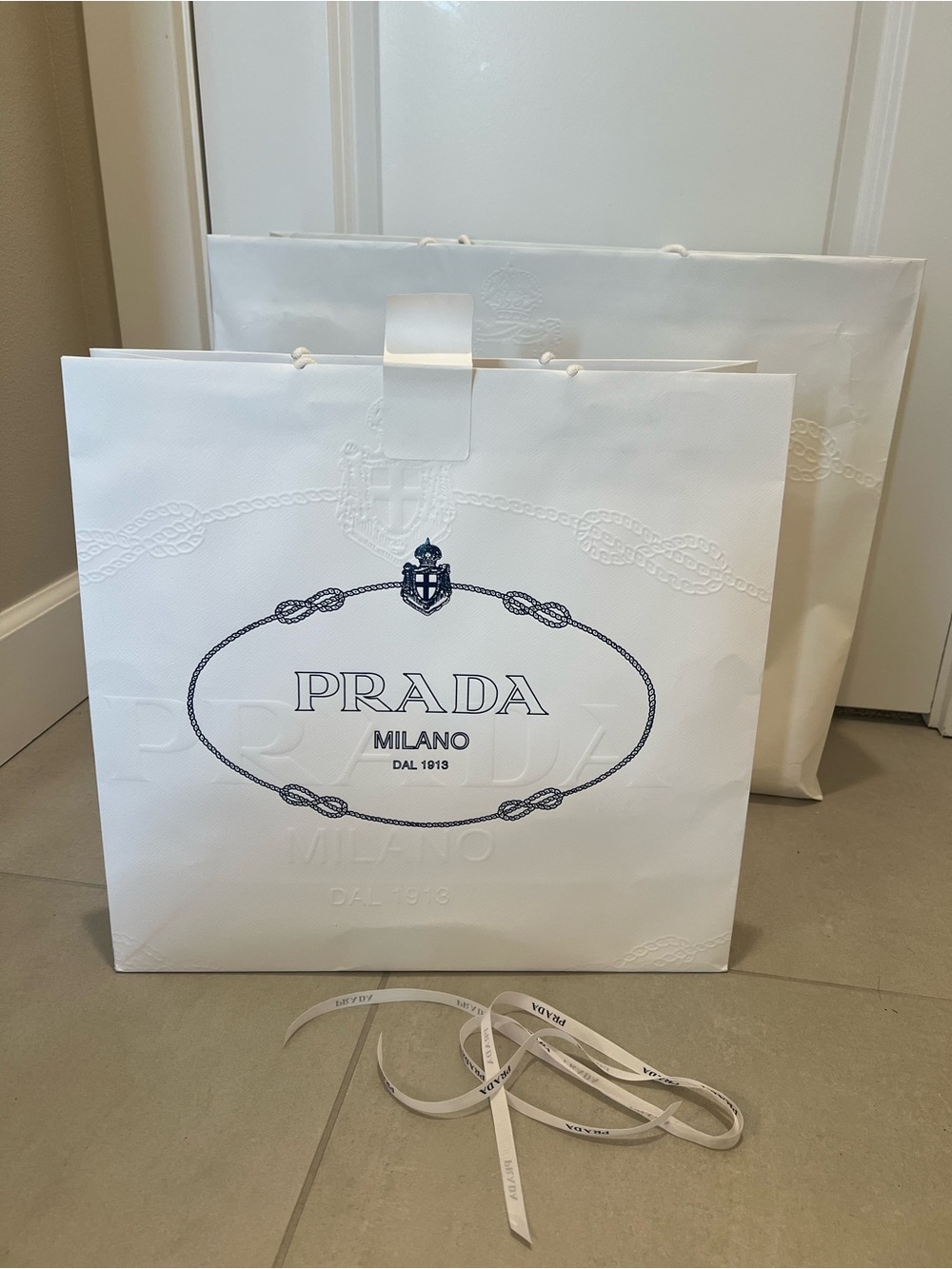 Prada shopping bags and ribbon